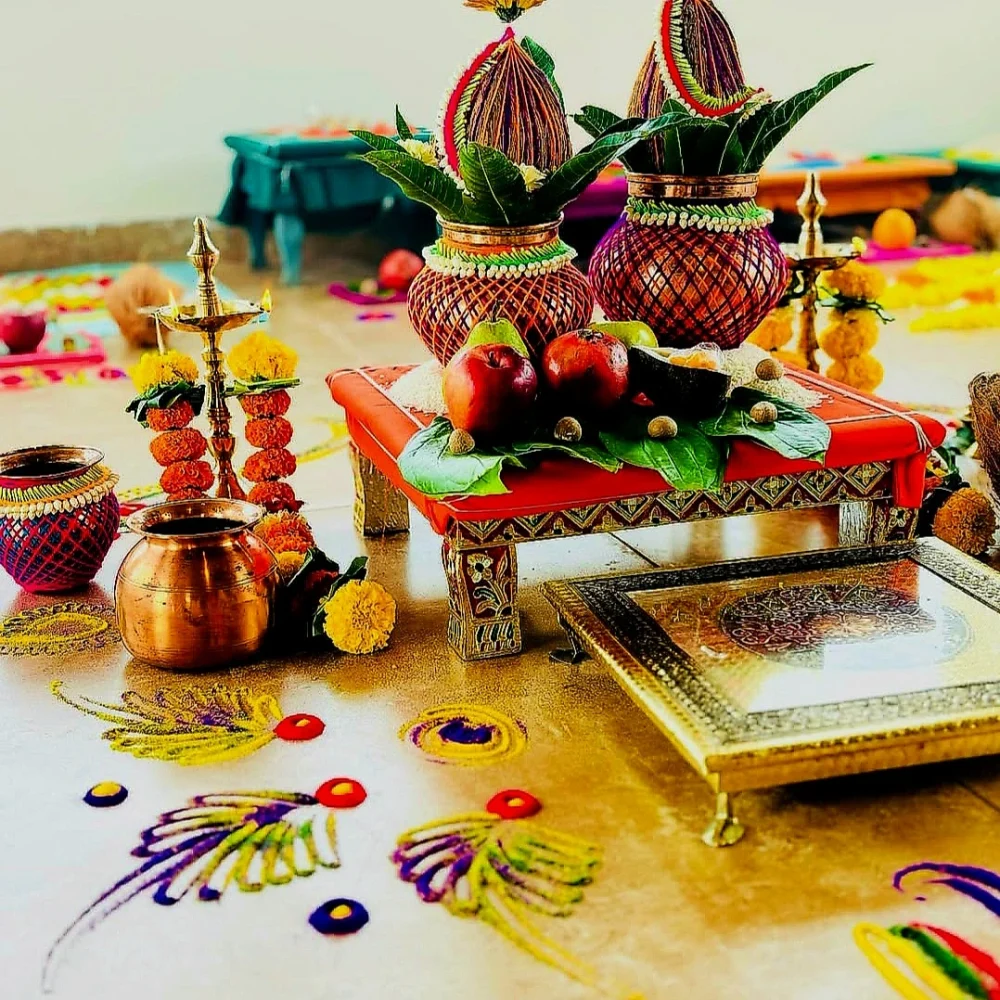 Vastu Shanti Puja being performed at home with Havan fire and Kalash.